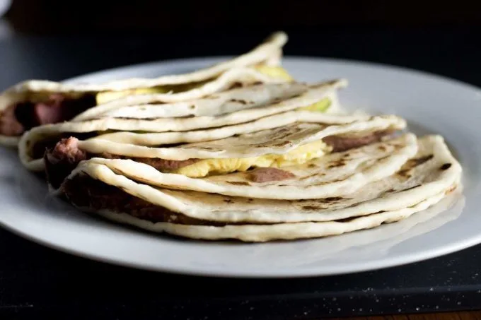 Honduran baleada, a folded flour tortilla filled with refried beans, cheese and cream