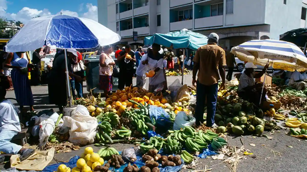 Colorful stalls of fruit, spices and hot sauces at the Castries Central Market, Saint Lucia
