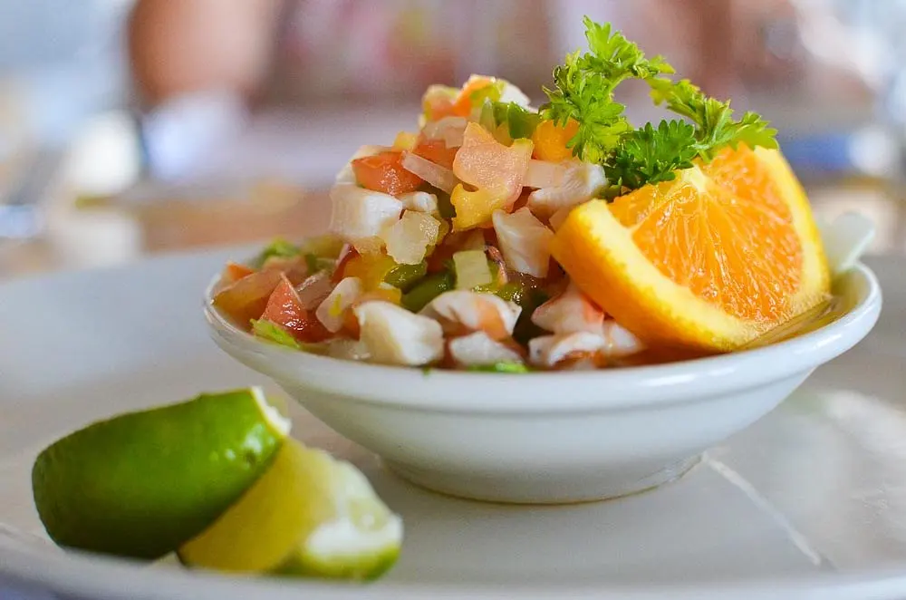 Fresh Bahamian conch salad with diced peppers, onion and citrus served at a waterfront shack on Bay Street, Harbour Island