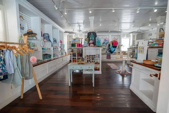 Small colorful boutique shop with straw hats and beachwear on display in Dunmore Town, Harbour Island