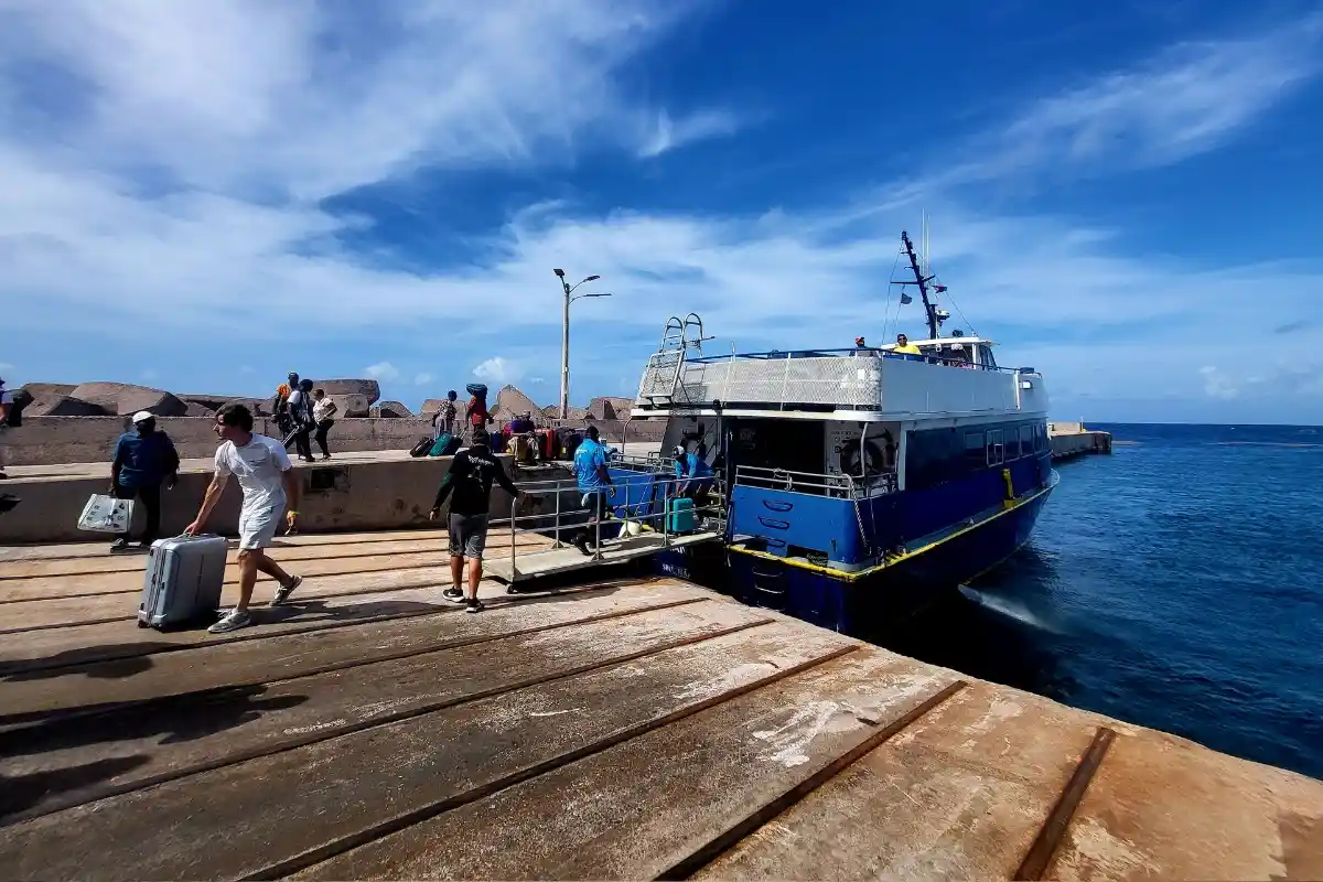 Passenger ferry crossing turquoise water from Saint Martin toward Anguilla