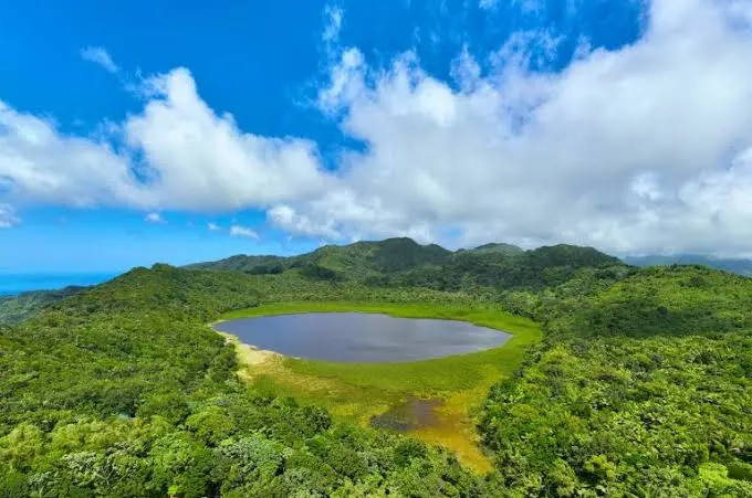 Grand Etang crater lake surrounded by misty rainforest in the mountains of central Grenada