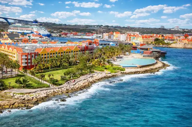 Colorful Dutch colonial buildings along the Handelskade waterfront in Willemstad, Curacao