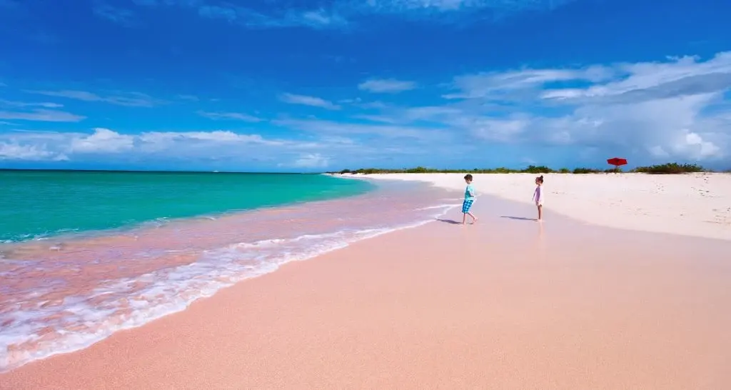 Aerial view of Harbour Island, Bahamas, showing Pink Sand Beach on the Atlantic side and Dunmore Town on the harbour side