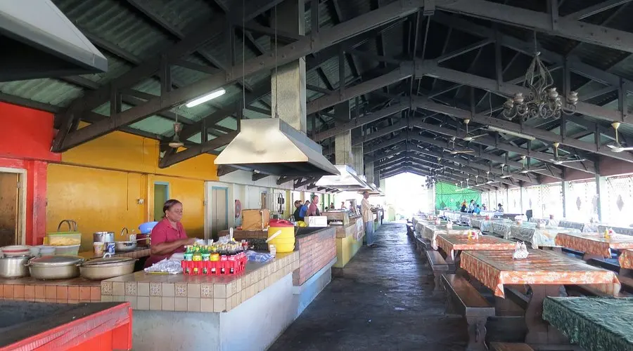 Plate of Curacao stew with funchi and rice served at Marshe Bieuw, the old market in Willemstad