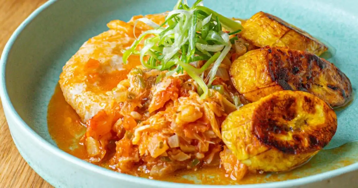 Plate of stewed saltfish with spicy plantain, coconut dumplings and seasoned breadfruit, the national dish of Saint Kitts and Nevis