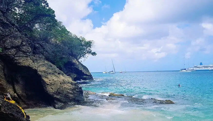 Golden sand and calm clear water at Princess Margaret Beach on Admiralty Bay, Bequia