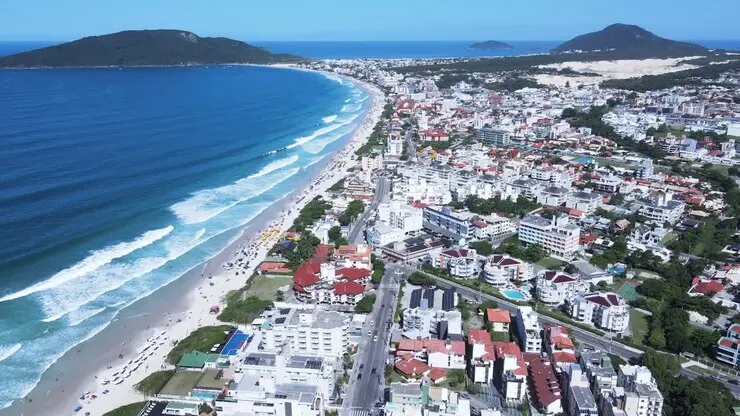 Aerial view of Saint Martin's coastline with turquoise bays, green hills and the Simpson Bay lagoon