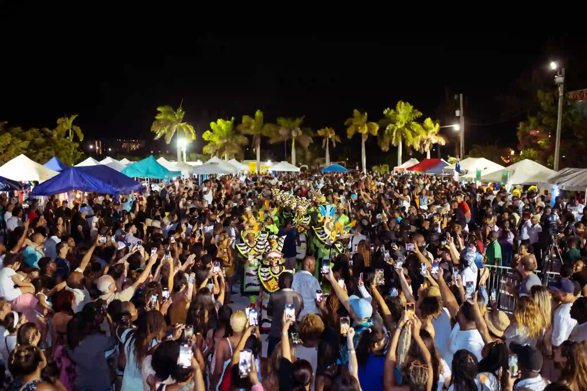 Crowds at food stalls and live music at the Thursday Fish Fry in Bight Park, Grace Bay