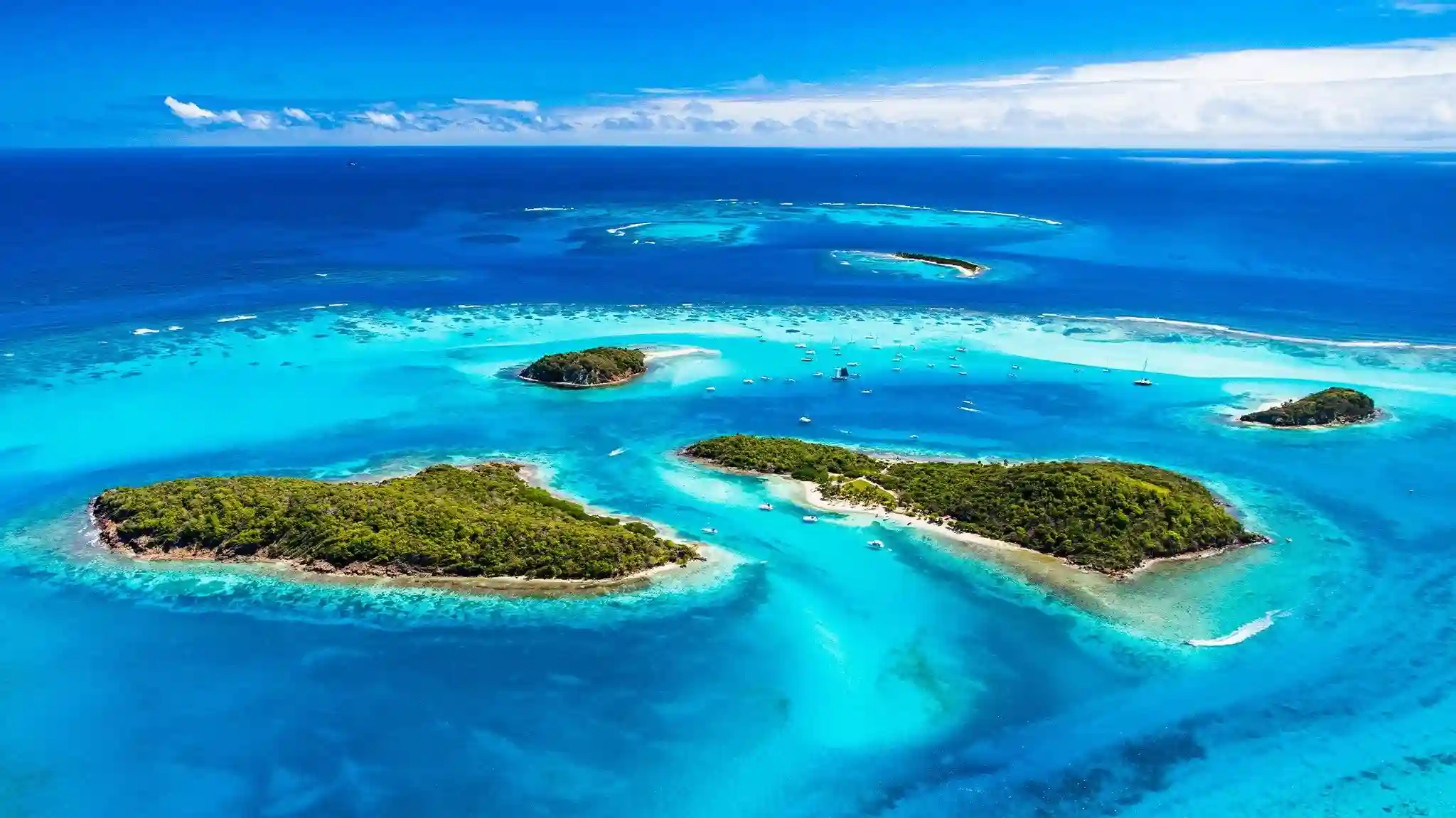 Turquoise lagoon and small uninhabited islands of the Tobago Cays Marine Park in the Grenadines