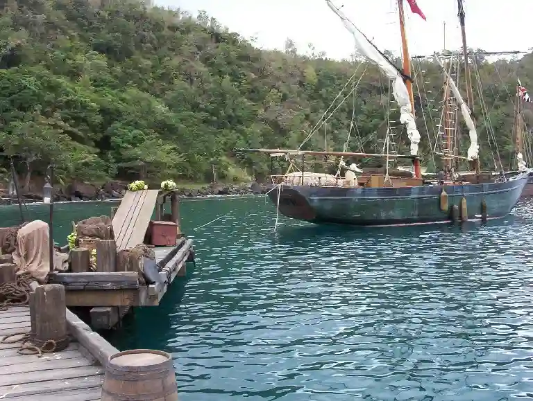 Wooden jetty and remaining film set buildings at Wallilabou Bay, Saint Vincent, used in Pirates of the Caribbean
