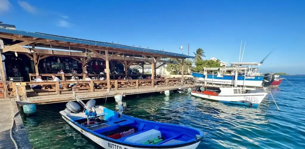 Plates of fried fish and shrimp at a waterfront table at Zeerovers in Savaneta, Aruba