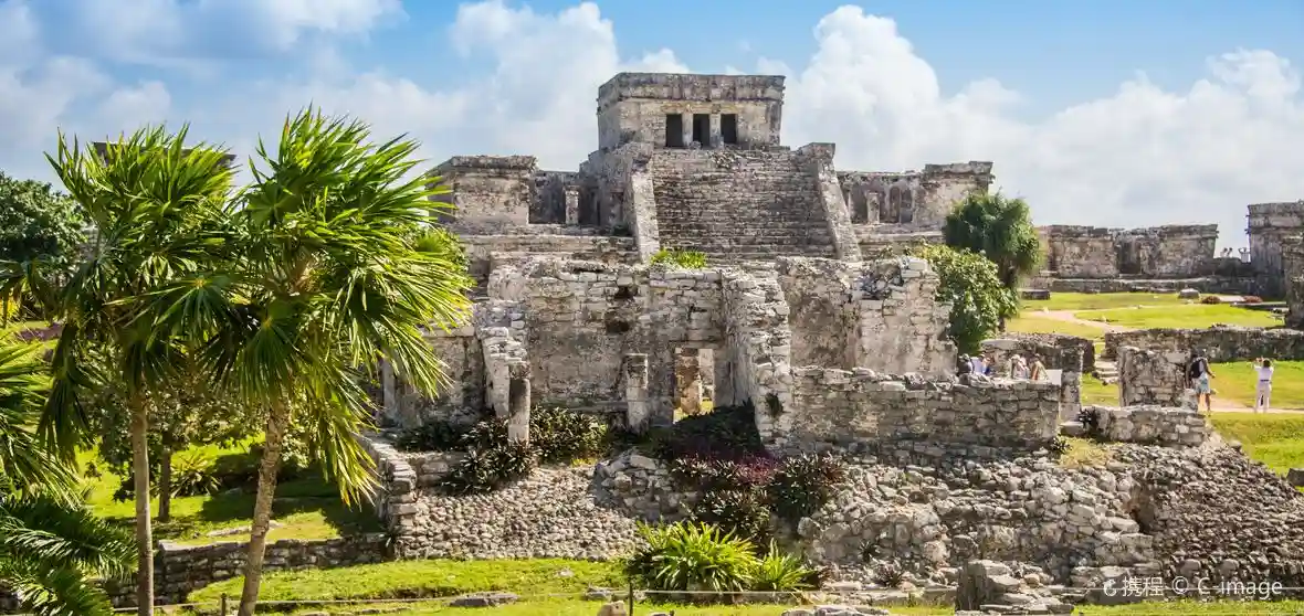Mayan ruins of Tulum on a clifftop overlooking the turquoise Caribbean Sea