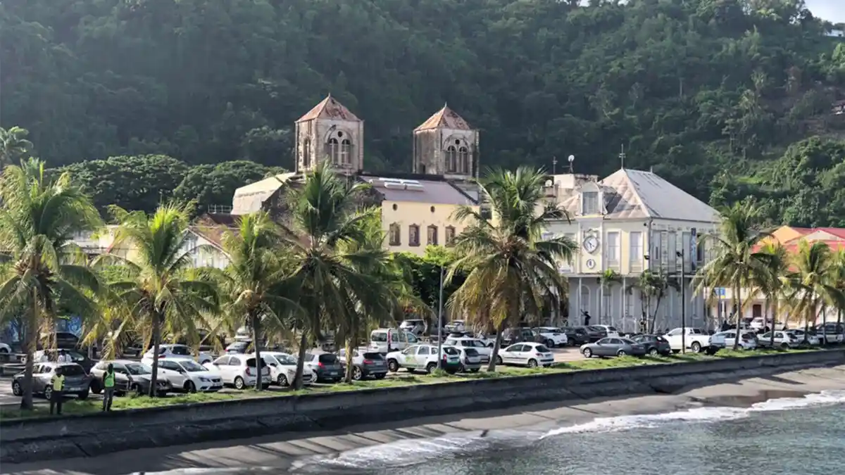 Stone ruins of the old theater in Saint-Pierre, Martinique, with Mont Pelée in the background