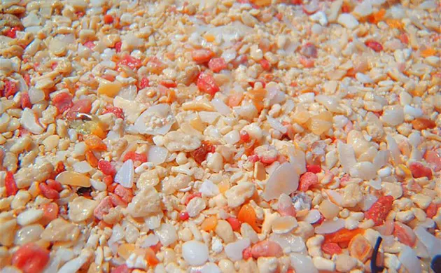 Soft pink sand and turquoise water stretching along Pink Sand Beach, Harbour Island, Bahamas